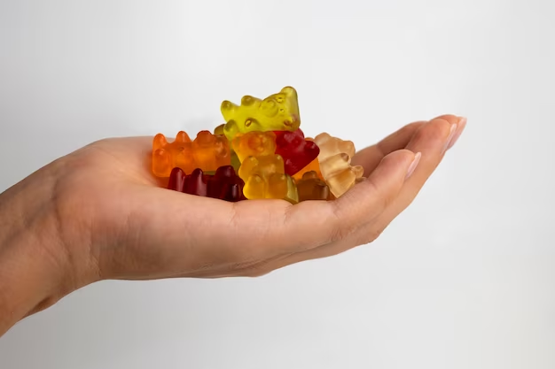 Man holding rubber bears in his hand